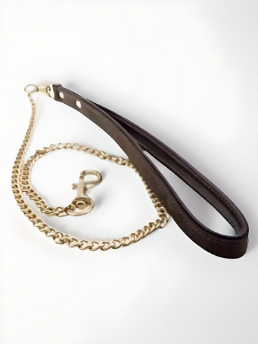 Luxurious Nubuck Leather Leash showcasing a high-quality durable handle and a heavy-duty golden chain, ideal for stylish pet owners.